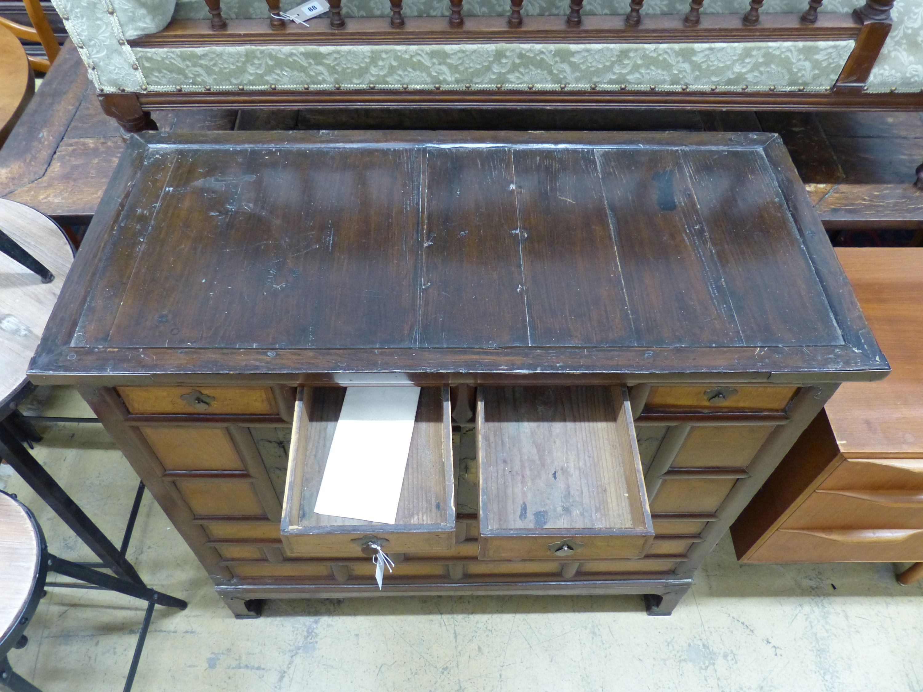 A Chinese elm cabinet, width 111cm